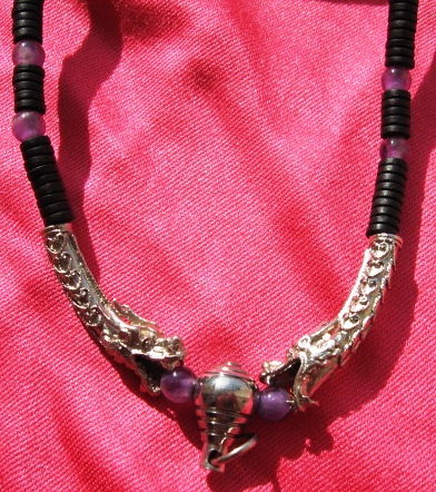 One Eyed Coconut Dragon Heads with Amethyst beads